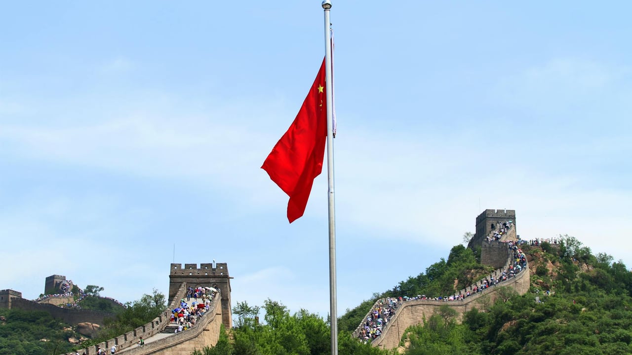A scenic view of the Great Wall of China with the Chinese national flag in Beijing.