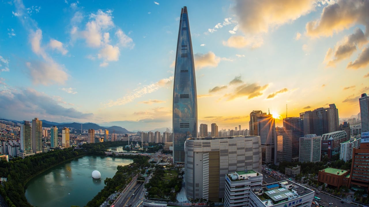 Stunning view of Seoul's skyline featuring Lotte World Tower at sunset.