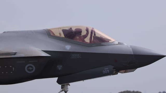 Close-up of an F-35 fighter jet with a pilot waving, captured at Geelong, VIC.