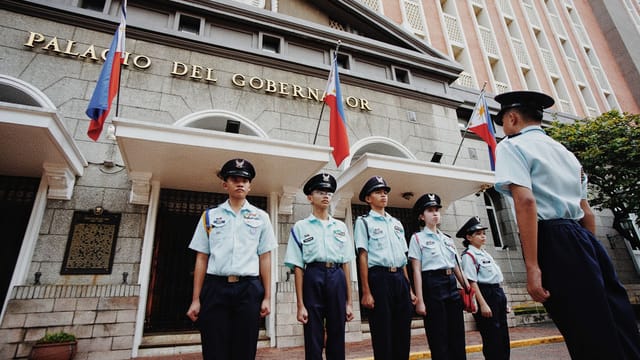 Cadets stand in formation outside the historic Palacio del Gobernador in Manila, Philippines.