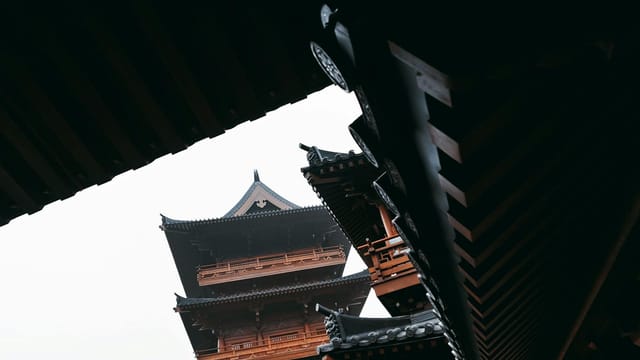 Low angle view of traditional wooden architecture in Nanjing, showcasing intricate details and cultural heritage.