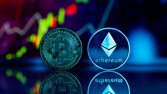 Close-up of Bitcoin and Ethereum coins with a financial chart background, reflecting digital currency trends.
