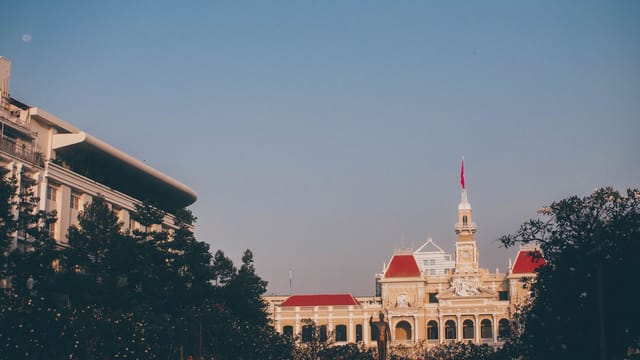 Elegant cityscape of the Ho Chi Minh City People's Committee Building at dusk.