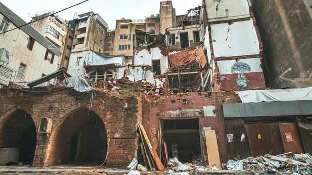 A striking view of damaged buildings in downtown Beirut, showcasing resilience amidst destruction.