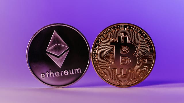 Close-up of Ethereum and Bitcoin coins symbolizing cryptocurrency and blockchain technology against a purple backdrop.