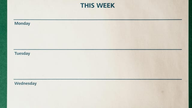 Minimalist blank weekly planner with days for scheduling and organizing tasks.