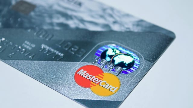 Detail shot of a MasterCard credit card, showing the chip and logo.