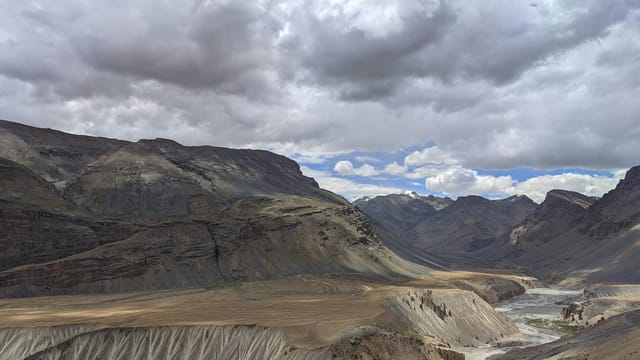 Breathtaking view of rugged mountains and valleys in Spiti Valley, Himachal Pradesh.