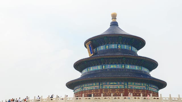 The majestic Temple of Heaven in Beijing, captured against a clear blue sky, showcasing ornate architecture.