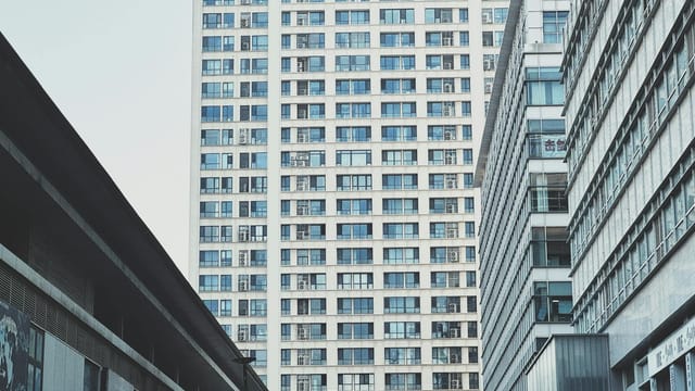 High-rise buildings in Tianjin, China, showcasing urban modern architecture with a bright sky.