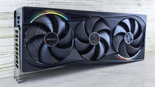 Triple fan GPU with RGB lighting, ideal for gaming setups and high-performance computing.