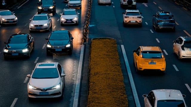 Traffic flows steadily on a bustling highway in Chengdu, China, capturing the city's evening commute.