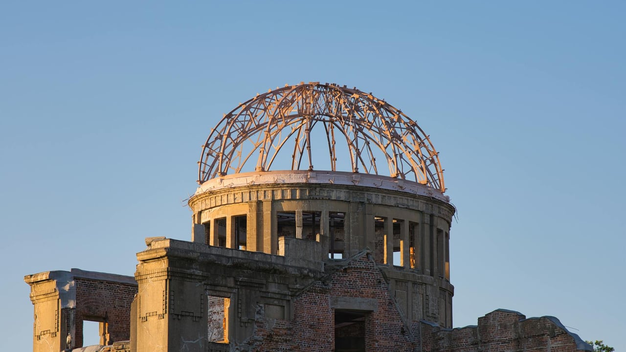 A solemn view of the Hiroshima Atomic Bomb Dome at sunset, symbolizing peace and resilience.