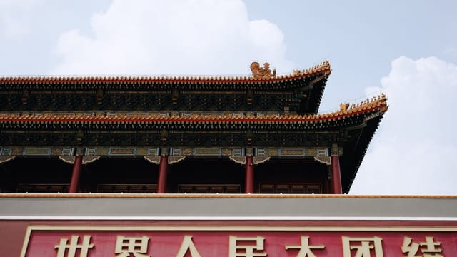 Close-up of traditional Chinese building with signage in Beijing.