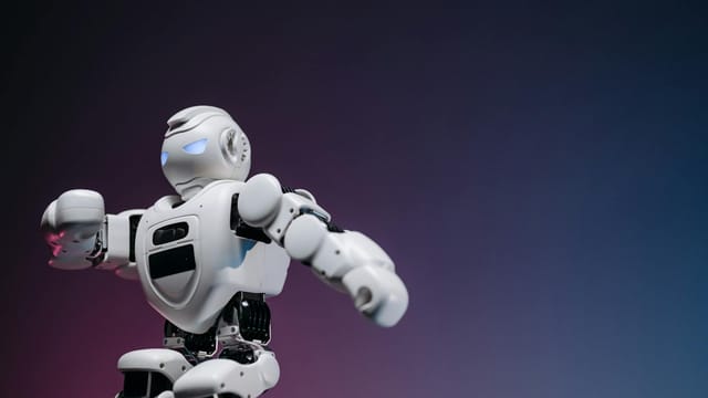 Close-up of a futuristic robotic toy against a gradient background, symbolizing innovation and technology.