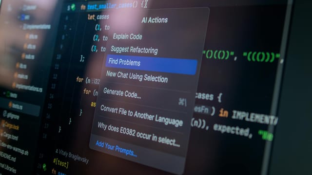 Detailed view of a computer screen displaying code with a menu of AI actions, illustrating modern software development.
