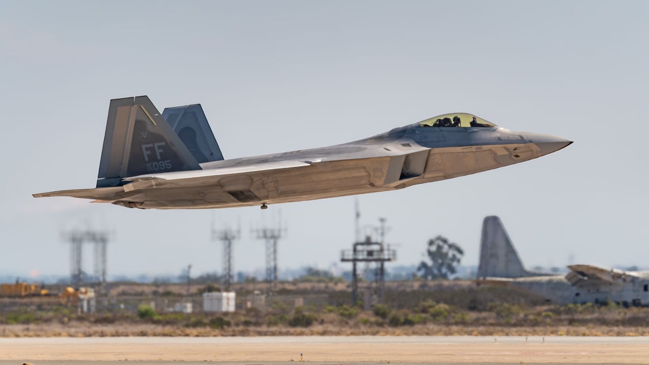 An F-22 Raptor jet fighter captured soaring above San Diego during an airshow.