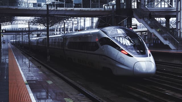 High-speed train at Zhenjiang Railway Station, showcasing modern transportation in China.