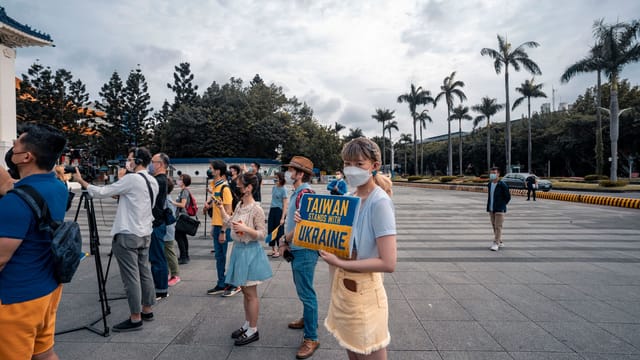Demonstration in Taiwan showing support for Ukraine with protestors holding banners.