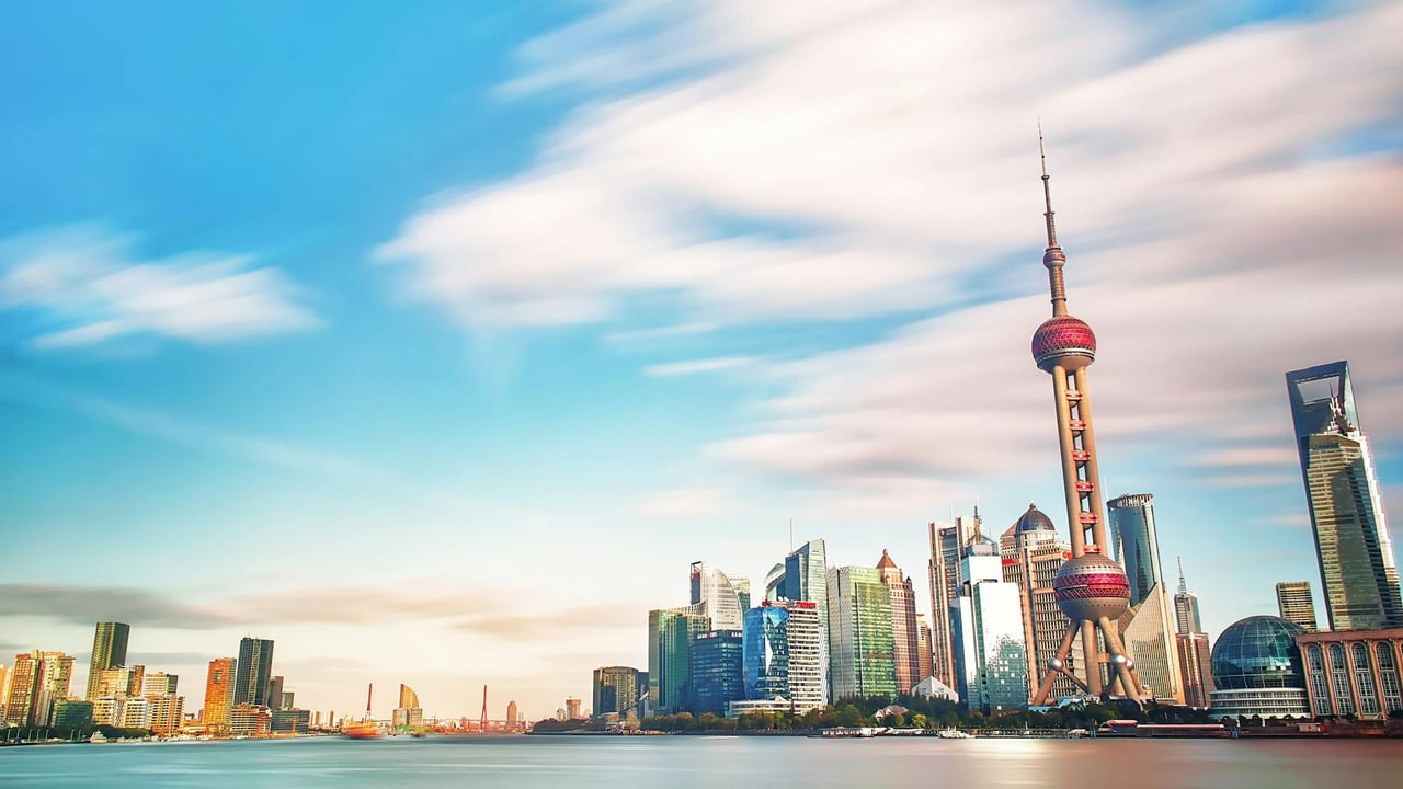 Stunning view of Shanghai's skyline featuring the iconic Oriental Pearl Tower and modern skyscrapers.