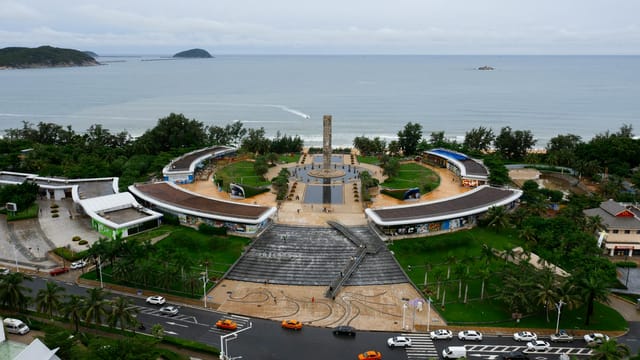 Discover the stunning landscape of Sanya Bay Park with its unique architecture and ocean backdrop in Hainan, China.