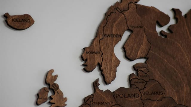 Intricate wooden map featuring Northern Europe and surrounding regions.
