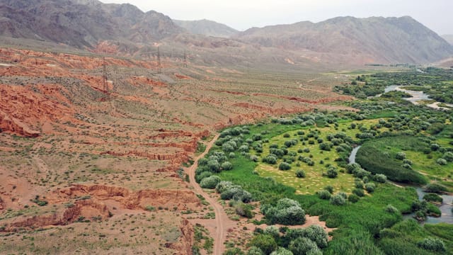 A breathtaking aerial view of Krasnyy Most's unique terrain in Kyrgyzstan.