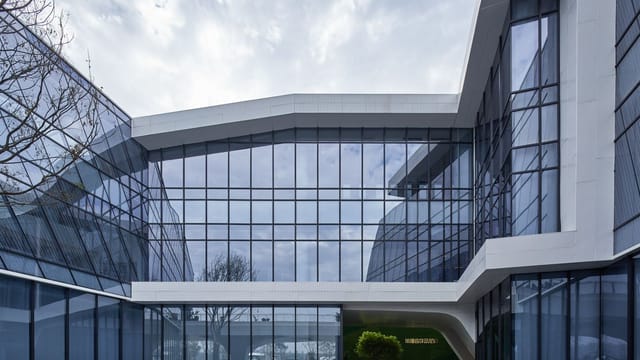 Contemporary building with glass facade in Sichuan, China showcasing modern architectural design.