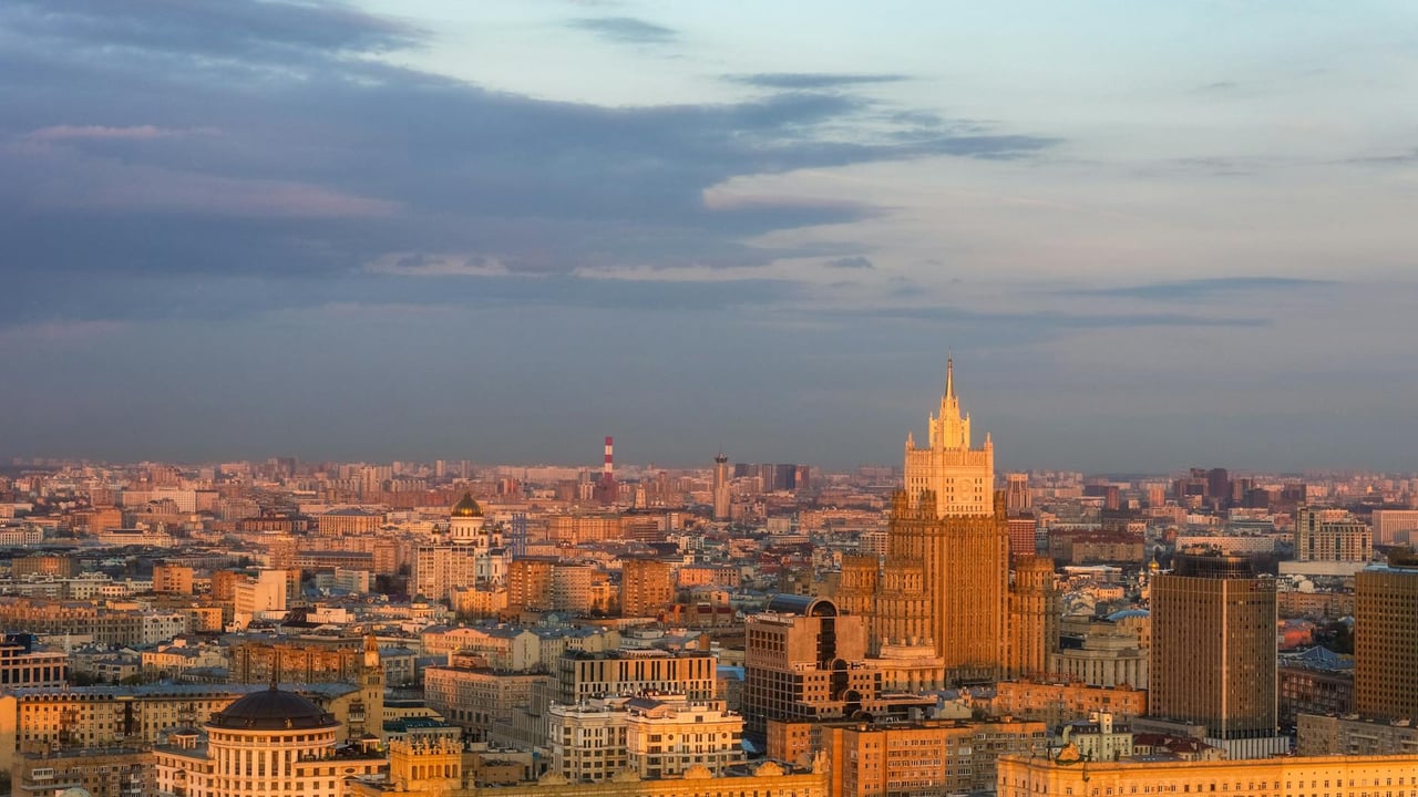 A breathtaking aerial shot showcasing Moscow's skyline with the Ministry of Foreign Affairs building at sunset.