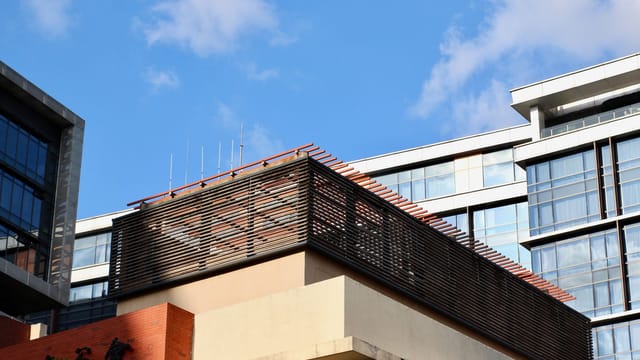 A modern architectural detail of a building facade in Shanghai, showcasing contemporary urban design elements.