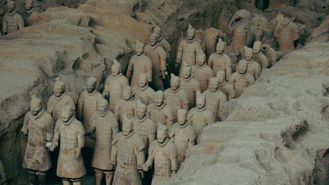 Terracotta Warriors excavation site in Xi'an, China, showcasing ancient clay statues of soldiers.