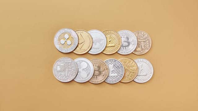 A collection of digital cryptocurrency coins, including Bitcoin and Ethereum, arranged on a stylish gold backdrop.