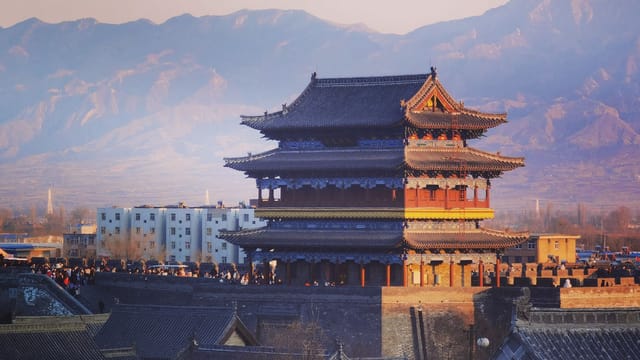 Beautiful traditional pagoda with mountains in Xin Zhou Shi, China.