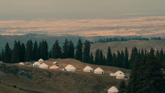 Beautiful landscape of yurts among mountains in Xinjiang, China.