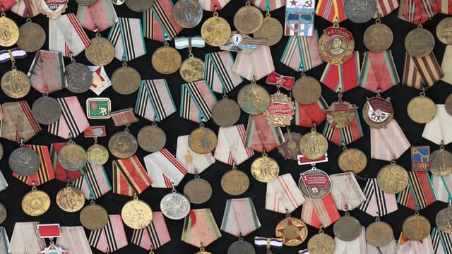 Assortment of Soviet military medals with vibrant ribbons.