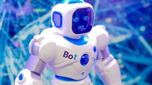 High-tech humanoid robot with LED face display, showcasing modern robotics and innovation.
