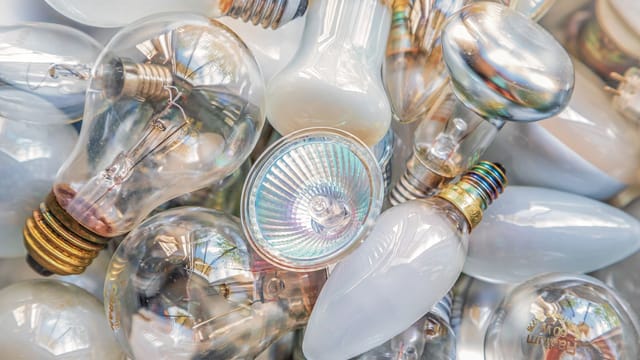 Close-up image of different types of light bulbs reflecting rich textures and patterns.