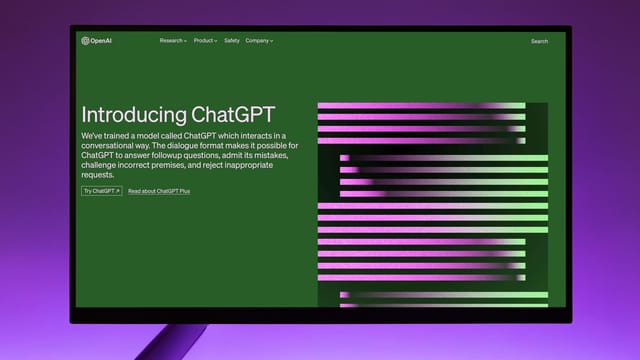 OpenAI Website with Introduction to ChatGPT on Computer Monitor