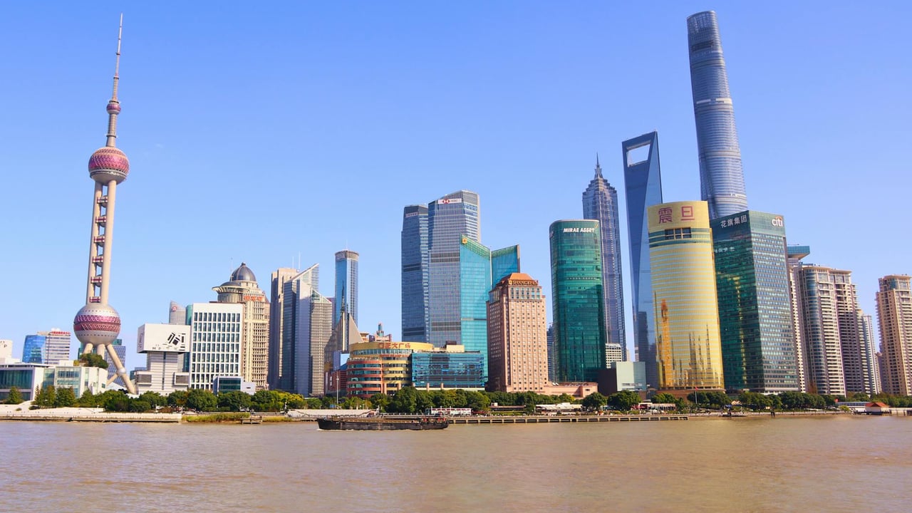 Stunning view of Shanghai's modern skyline featuring the iconic Oriental Pearl Tower on a sunny day.