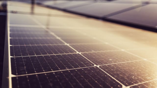 Illustrative image: Close-up of solar panels harnessing renewable energy under the Austrian sun.