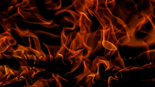 Close-up of vibrant flames creating a dramatic and intense warm glow.