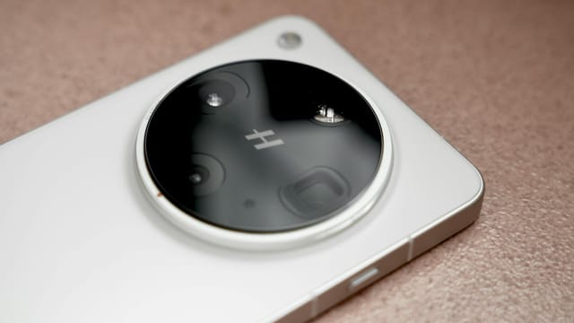 A detailed view of a smartphone camera lens in a minimalist design, emphasizing technology.
