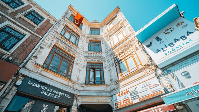 A vibrant low angle view of a historical Turkish building facade on a sunny day.