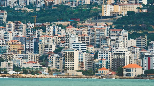Panoramic view of dense residential buildings along Jounieh's waterfront in Lebanon, highlighting urban architecture.