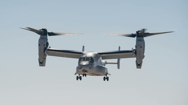 Bell Boeing V-22 Osprey aircraft flying against a clear sky in Miramar, CA.