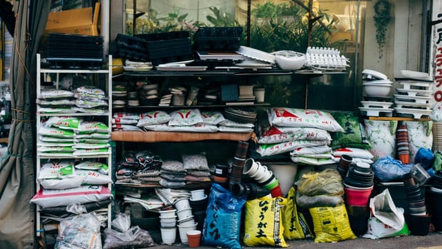 A vibrant market stall in Seoul displaying a variety of gardening materials and supplies.