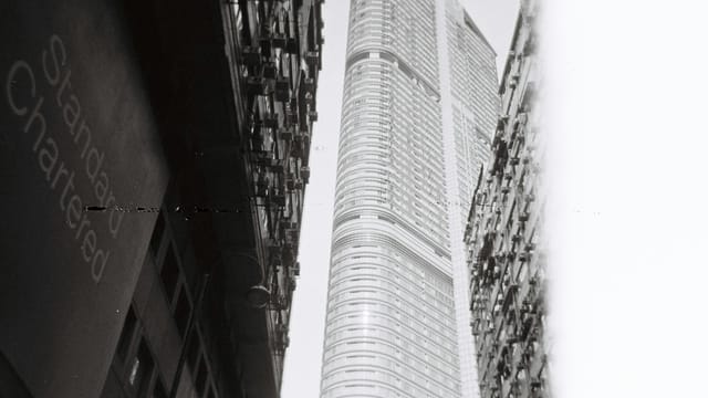 Low angle view of skyscrapers in Hong Kong, emphasizing modern architecture.