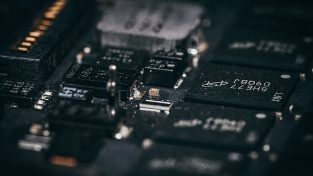 Detailed macro shot of electronic circuit components showcasing intricate design and layout.