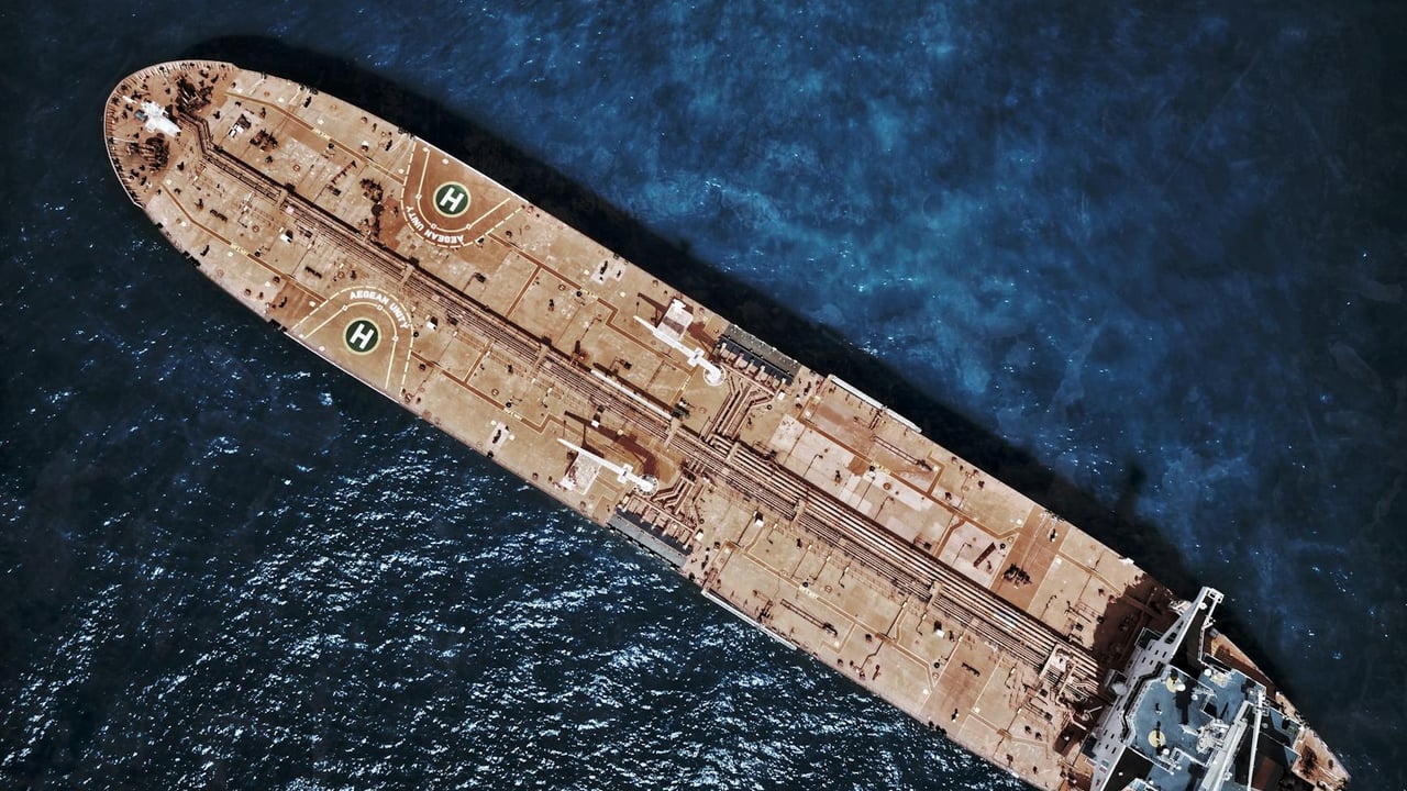 Drone shot of large tanker ship with helipads in ocean waters.