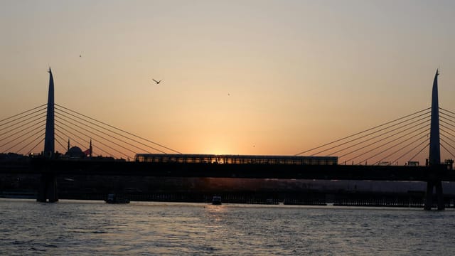 Beautiful sunset view over the Golden Horn Metro Bridge in Istanbul, Turkey.